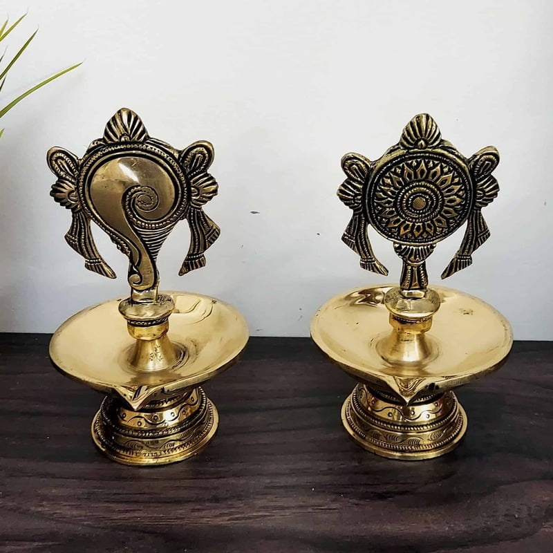 Brass Shankhchakra Diya Set - 6 inch Height | Traditional Brass Shankhchakra Diya Set for Lighting Brass Shankhchakra Diya Set - 6 inch Height | Traditional Brass Shankhchakra Diya Set for Lighting