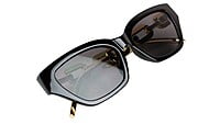 Female Large Cat Eye Sunglass. Black Rim. Golden Temple. Female Large Cat Eye Sunglass. Black Rim. Golden Temple.