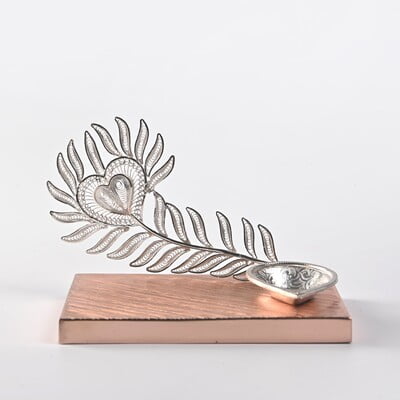 Exquisite Peacock feather diya Exquisite Peacock feather diya