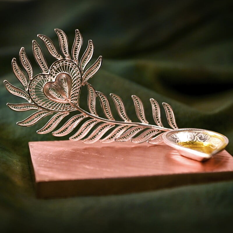 Exquisite Peacock feather diya Exquisite Peacock feather diya