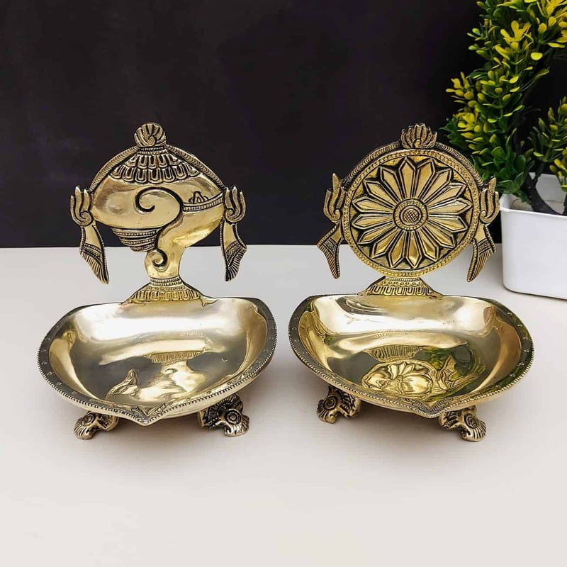 Brass Shankh Chakra Diya Set of Two - 6 inch Height | Traditional Brass Diya Set with Shankh and Chakra Design Brass Shankh Chakra Diya Set of Two - 6 inch Height | Traditional Brass Diya Set with Shankh and Chakra Design