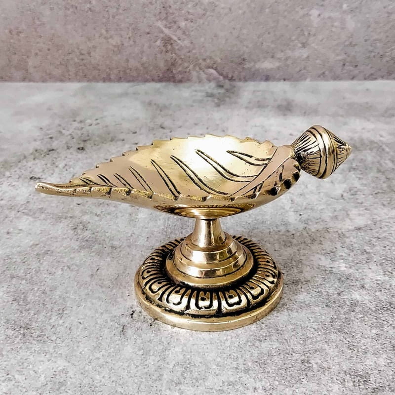 Brass Leaf Diya - 2.7 inch Height | Intricate Brass Leaf-shaped Diya for Lighting Brass Leaf Diya - 2.7 inch Height | Intricate Brass Leaf-shaped Diya for Lighting