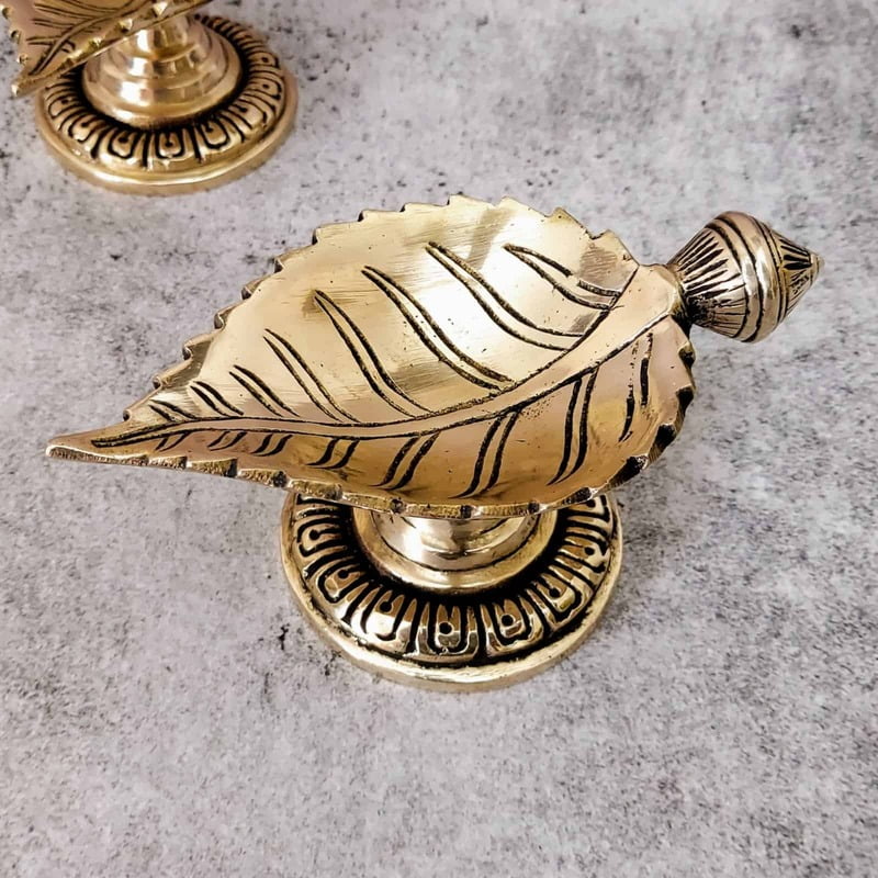 Brass Leaf Diya - 2.7 inch Height | Intricate Brass Leaf-shaped Diya for Lighting Brass Leaf Diya - 2.7 inch Height | Intricate Brass Leaf-shaped Diya for Lighting