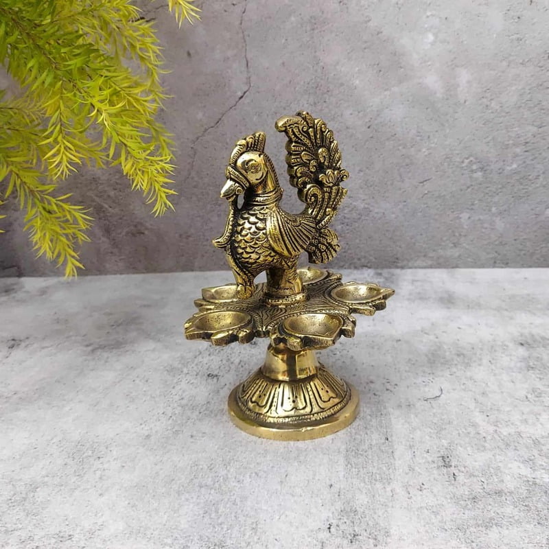 Brass Peacock Five Wick Diya - 6.5 inch Height | Brass Diya with Peacock Design for Festivals Brass Peacock Five Wick Diya - 6.5 inch Height | Brass Diya with Peacock Design for Festivals