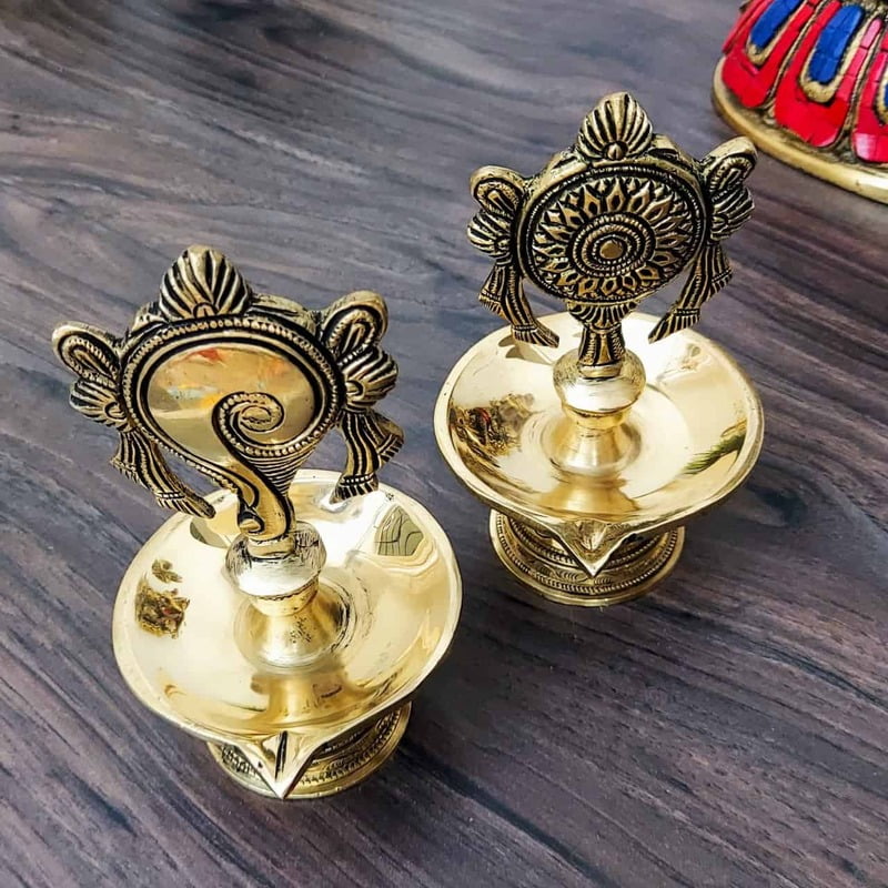 Brass Shankhchakra Diya Set - 6 inch Height | Traditional Brass Shankhchakra Diya Set for Lighting Brass Shankhchakra Diya Set - 6 inch Height | Traditional Brass Shankhchakra Diya Set for Lighting