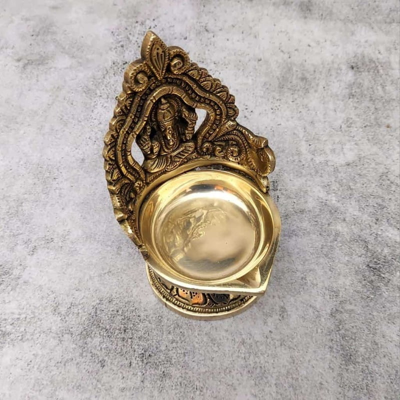 Brass Ganesh Deepak - 5.5 inch Height | Divine Brass Deepak with Lord Ganesh for Illuminating Worship Brass Ganesh Deepak - 5.5 inch Height | Divine Brass Deepak with Lord Ganesh for Illuminating Worship