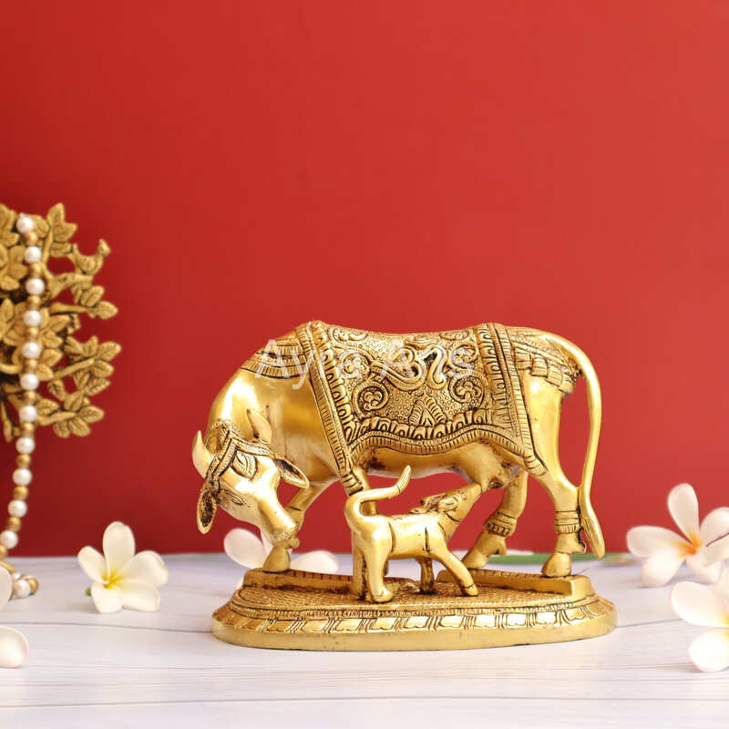 Brass Kamdhenu Holy Cow And Calf with OM symbol- 5 Inch Height Brass Kamdhenu Holy Cow And Calf with OM symbol- 5 Inch Height