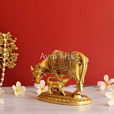 Brass Kamdhenu Holy Cow And Calf with OM symbol- 5 Inch Height Brass Kamdhenu Holy Cow And Calf with OM symbol- 5 Inch Height