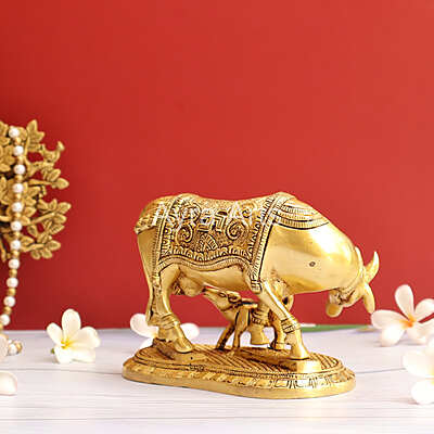 Brass Kamdhenu Holy Cow And Calf with OM symbol- 5 Inch Height Brass Kamdhenu Holy Cow And Calf with OM symbol- 5 Inch Height
