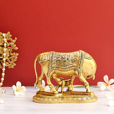 Brass Kamdhenu Holy Cow And Calf with OM symbol- 5 Inch Height Brass Kamdhenu Holy Cow And Calf with OM symbol- 5 Inch Height