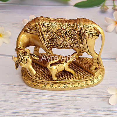 Brass Kamdhenu Holy Cow And Calf with OM symbol- 5 Inch Height Brass Kamdhenu Holy Cow And Calf with OM symbol- 5 Inch Height