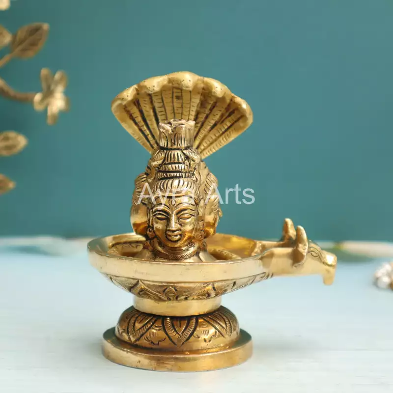 Brass Three Face Shivling Trimukhi Shivlingham with Panchmukhi Sheshnaag and Gomukh Jal Dhara - 5 Inch Height Brass Three Face Shivling Trimukhi Shivlingham with Panchmukhi Sheshnaag and Gomukh Jal Dhara - 5 Inch Height