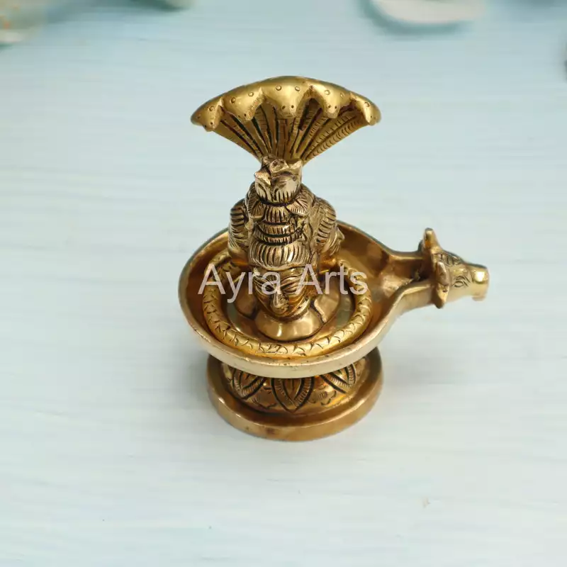 Brass Three Face Shivling Trimukhi Shivlingham with Panchmukhi Sheshnaag and Gomukh Jal Dhara - 5 Inch Height Brass Three Face Shivling Trimukhi Shivlingham with Panchmukhi Sheshnaag and Gomukh Jal Dhara - 5 Inch Height