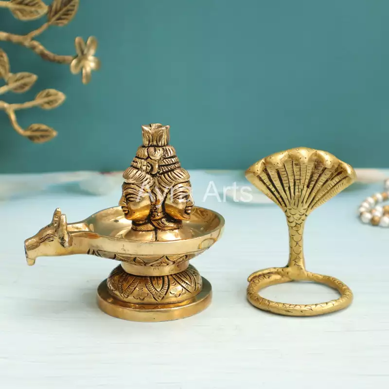 Brass Three Face Shivling Trimukhi Shivlingham with Panchmukhi Sheshnaag and Gomukh Jal Dhara - 5 Inch Height Brass Three Face Shivling Trimukhi Shivlingham with Panchmukhi Sheshnaag and Gomukh Jal Dhara - 5 Inch Height