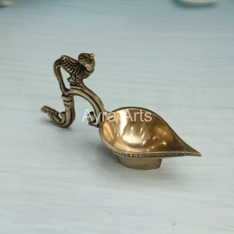 Ek Aarti Brass Bird Diya - 3.2 inch Height | Decorative Brass Diya with Bird Design Ek Aarti Brass Bird Diya - 3.2 inch Height | Decorative Brass Diya with Bird Design