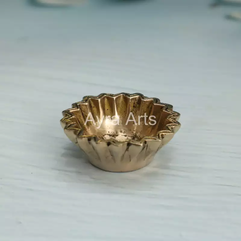 Brass Sun Design Swastik Diya - 1 Inch Height Brass Sun Design Swastik Diya - 1 Inch Height