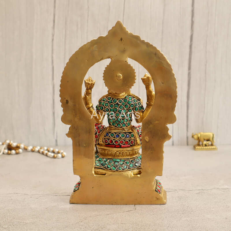 Brass Goddess Lakshmi Seated on Singhasan with Arch in Stonework - 9.5 Inch Height