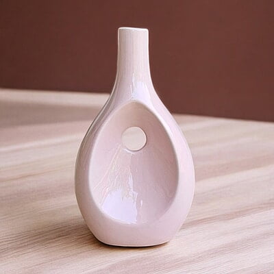 Pink Ceramic Vase with Unique Cutout Design Pink Ceramic Vase with Unique Cutout Design