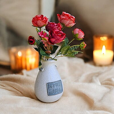 White Ceramic Vase with "Depuis 1884" Detail White Ceramic Vase with "Depuis 1884" Detail