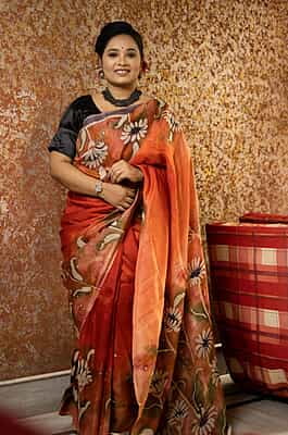 Rust Orange color pure Mulberry silk with flower hand batik motif saree from our Mystic Radainave collection Rust Orange color pure Mulberry silk with flower hand batik motif saree from our Mystic Radainave collection