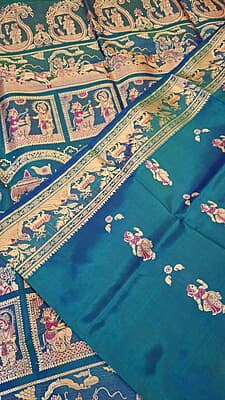 Blue green dual tone figure motif with heeran motif on the border with meena Baluchari saree