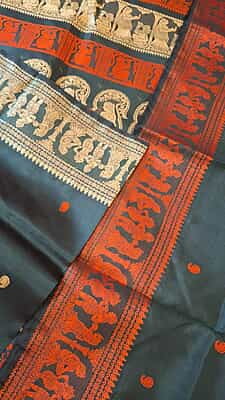 Black color pure Mulberry silk saree Baluchari saree with orange and beige ganga Jamuna border Black color pure Mulberry silk saree Baluchari saree with orange and beige ganga Jamuna border