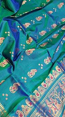 Color Blue green dual tone with golden colour zari Figure motif Swarnachari Color Blue green dual tone with golden colour zari Figure motif Swarnachari