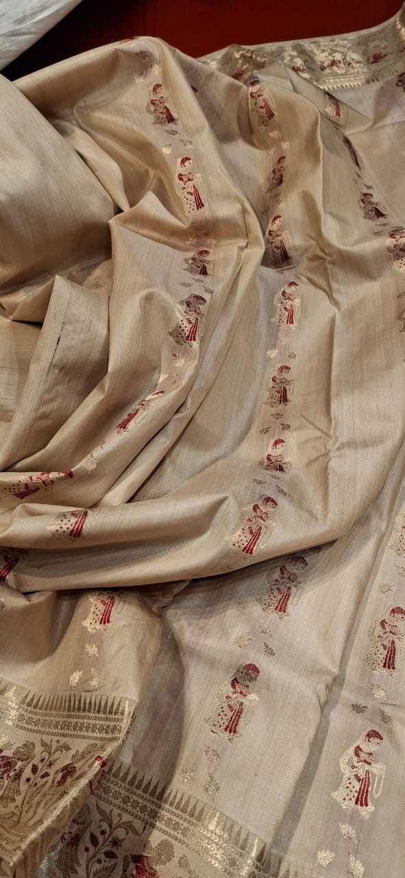 Figure motif Swarnachari in pure tassar with golden zari and red meena Figure motif Swarnachari in pure tassar with golden zari and red meena