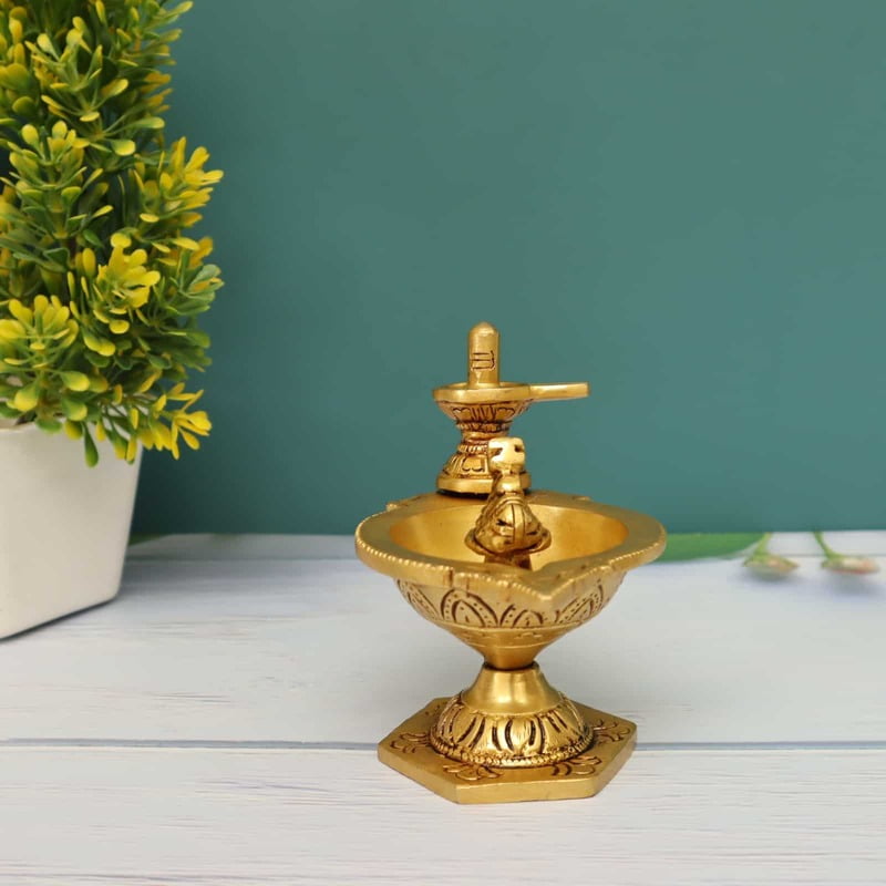 Brass Shivling Diya/Pradosha Deepam with Lingam and Nandhi/Vilakku - 4 inch Height | Sacred Brass Shivling Diya/Pradosha Deepam with Lingam and Nandhi/Vilakku Brass Shivling Diya/Pradosha Deepam with Lingam and Nandhi/Vilakku - 4 inch Height | Sacred Brass Shivling Diya/Pradosha Deepam with Lingam and Nandhi/Vilakku